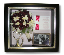shadowbox with bouquet and wedding memorabilia